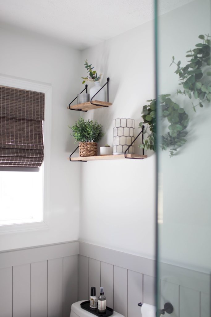 Sherwin Williams Pure White with floating shelves in small bathroom. Light French Gray beadboard walls. Kylie M Interiors Edesign, client photo