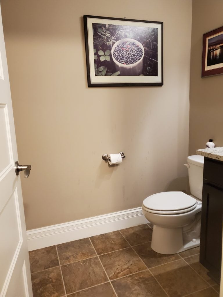 Bathroom with beige tile before edesi
