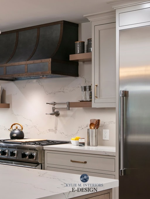 Benjamin Moore Revere Pewter painted kitchen cabinets, white quartz backsplash & countertop Caesarstone Statuario Nuvo, custom metal zinc range hood. Stainless. Kylie M Edesigns