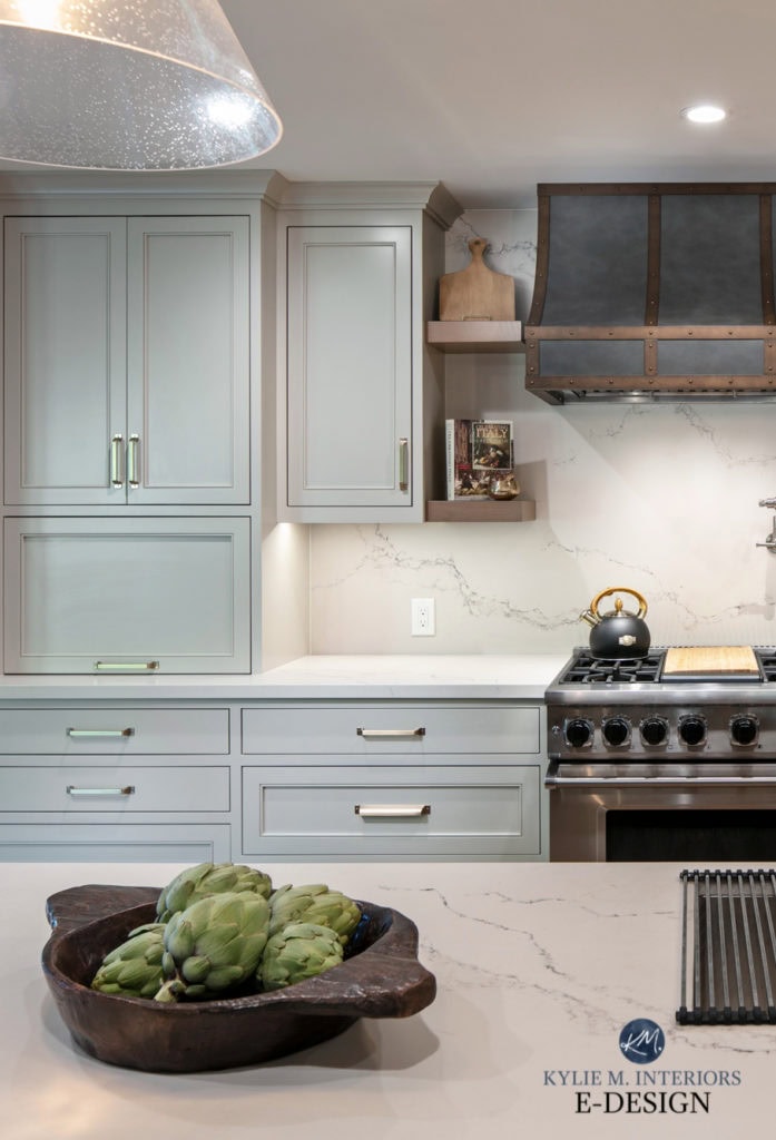 Caesarstone Statuario Nuvo white quartz kitchen countertop and backsplash, Benjamin Moore Revere Pewter painted cabinets, metal range hood. Kylie M Interiors Edesign, diy update ideas