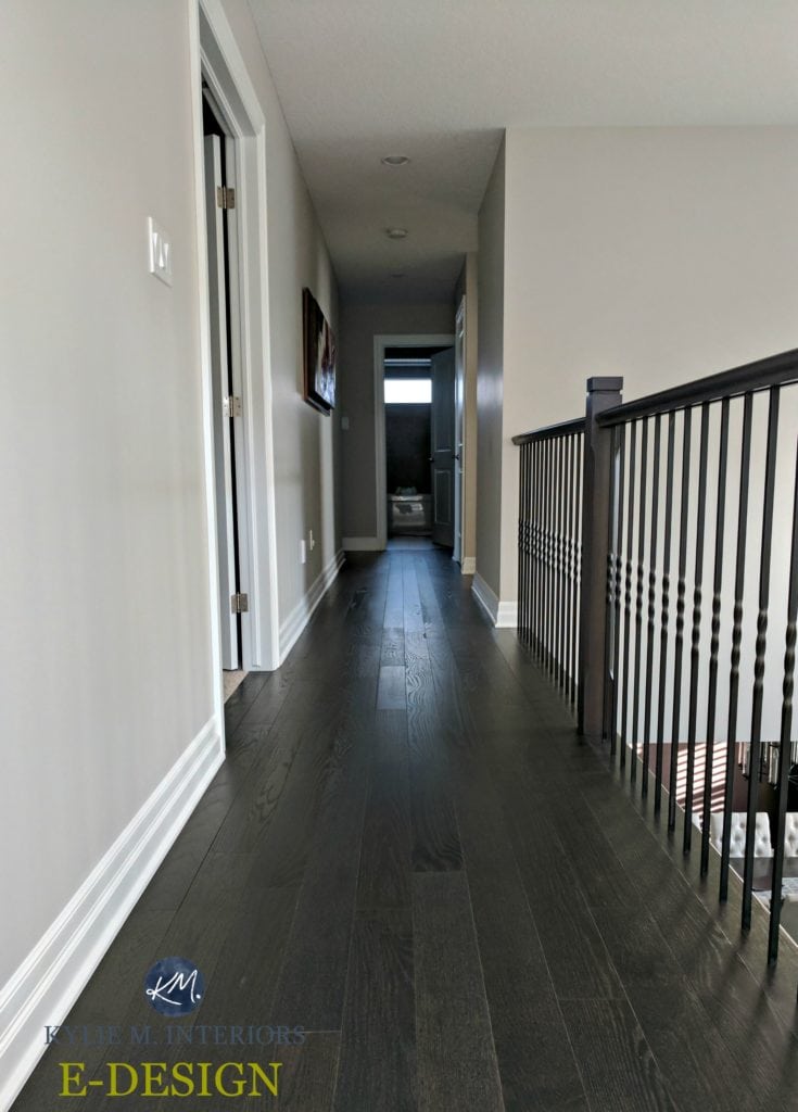 E-design-and-online-colour-consultation-by-color-expert-and-blogger-Kylie-M-INteriors.-Benjamin-Moore-Collingwood-in-a-hallway-with-dark-wood-flooring-and-black-metal-railing