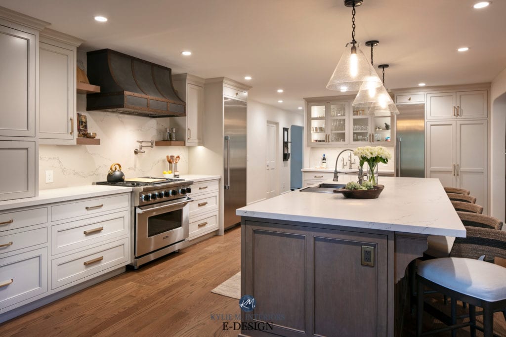 Kitchen wood island, wood floor, Revere Pewter Benjamin Moore painted cabinets (darkened). Caesarstone Statuario Nuvo quartz countertops. Pendan lights, metal range hood, Kylie M Edesigns