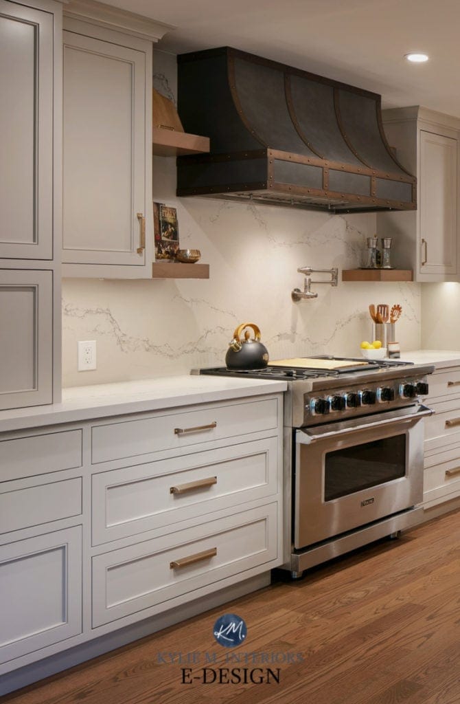 Revere Pewter (warm gray) on painted kitchen cabinets. Caesarstone Statuario Nuvo quartz countertops. Stainless appliances, custom metal range hood, Kylie M Edesigns