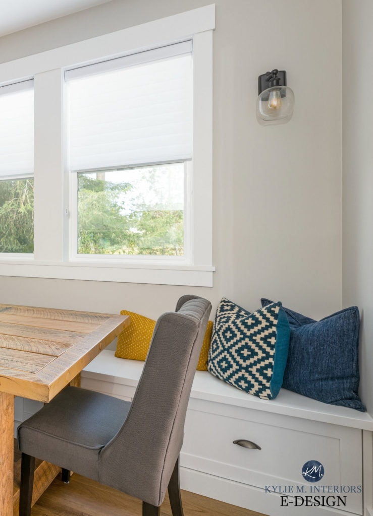 Benjamin Moore Stonington Gray in dining room with rustic wood table and built-in white bench with drawers and cushions. Kylie M Interiors E-design, online paint colour consulting blog