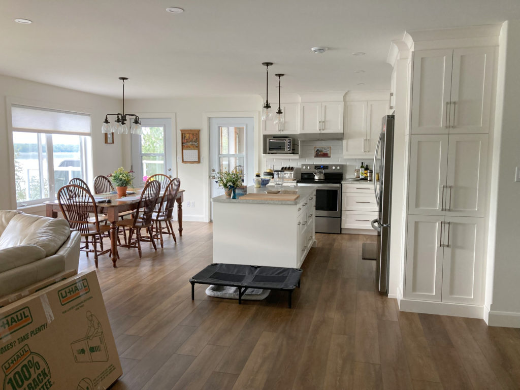 South facing room Benjamin Moore Cloud White, unpainted back doors. Edesign example