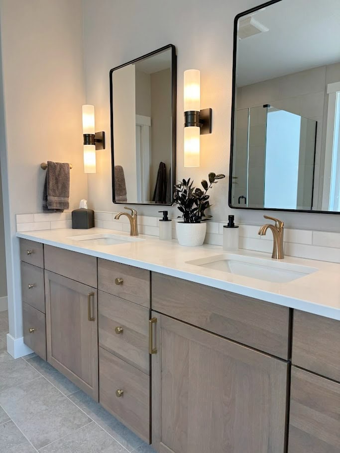 BATHROOM, ALDER WOOD DOUBLE VANITY, BLACK MIRROR, LIGHTS, GOLD BRASS FAUCET, HARDWARE, WOOD VANITY, GREIGE TAUPE TILE FLOOR, SHERWIN WILLIAMS AGREEABLE GRAY PAINT COLOR ON WALLS (2)