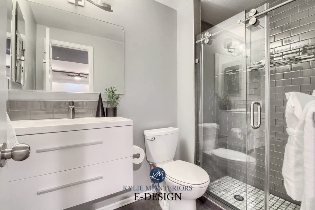 Bathroom with greige taupe warm gray tile, white vanity and quartz, Light French Gray paint color on walls. Kylie M interiors Edesign