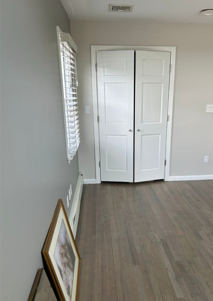 Benjamin Moore Barren Plains with gray wash wood oak floor and white trim.
