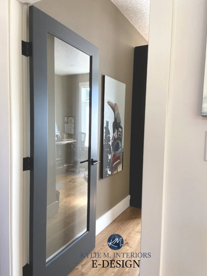 Benjamin Moore Cheating Heart on a painted glass door, White Dove walls and Benjamin Moore Smoky Ash brown . Cozy home office.