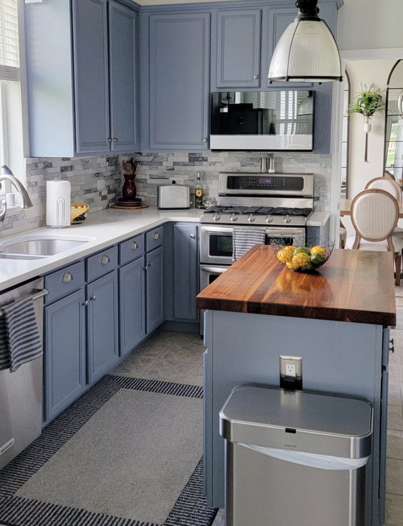 Blue painted kitchen cabinets, Benjamin Moore Bachelor Blue, butcher block, white quartz, backsplash tile. Kylie M Interiors CLIENT PHOTO