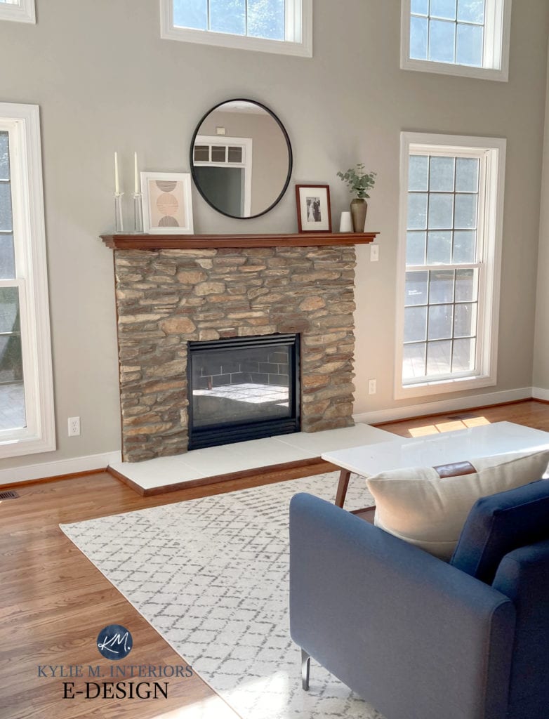 Brown stone fireplace with Benjamin Moore greige taupe paint colour on walls, oak floor. Kylie M Interiors Edesign, client photo