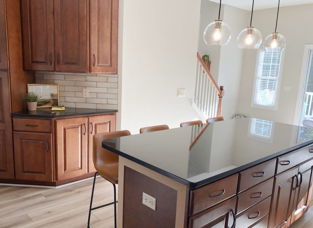Dark black granite, cherry red maple wood cabinets, Benjamin Moore Edgecomb Gray. Kylie M edesign CLIENT PHOTO