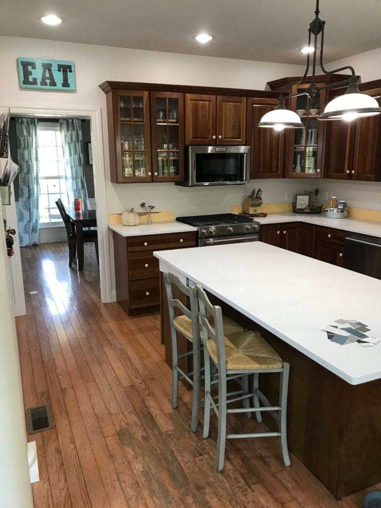 Dark wood kitchen cabinets before being painted