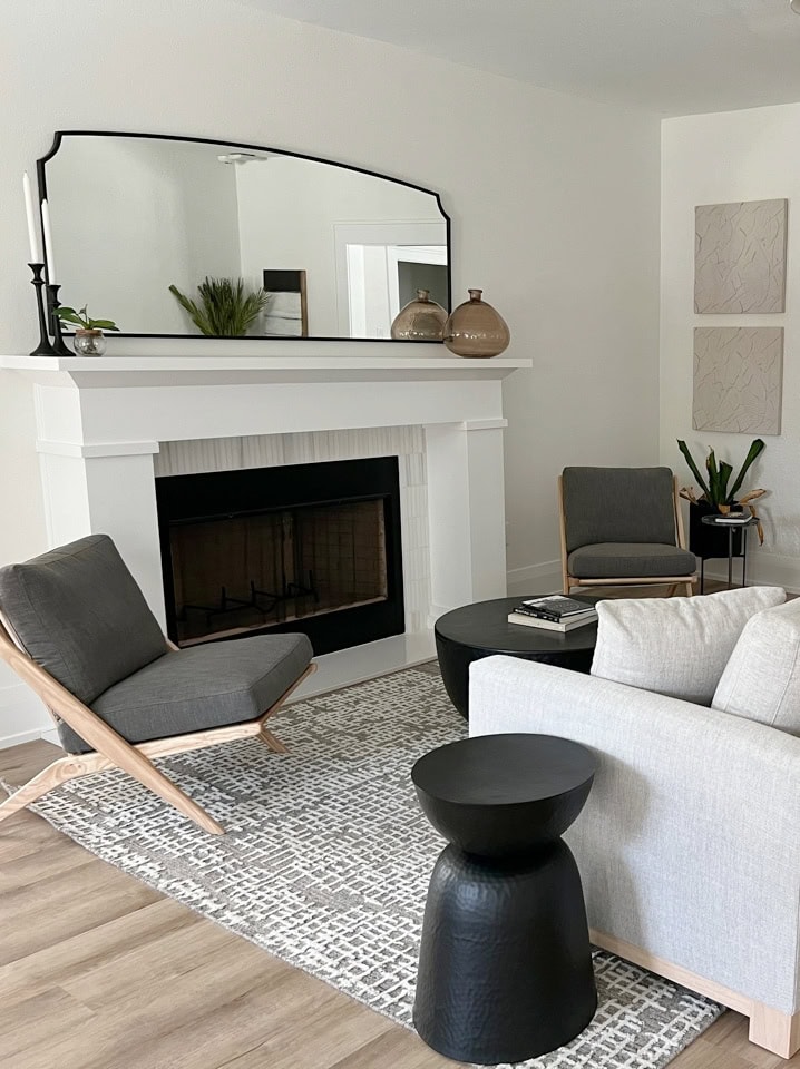 Greek Villa warm white on walls, Sherwin Williams Extra White trim and fireplace surround, neutral furniture, transitional style, wood look floor, shotgun style (1)