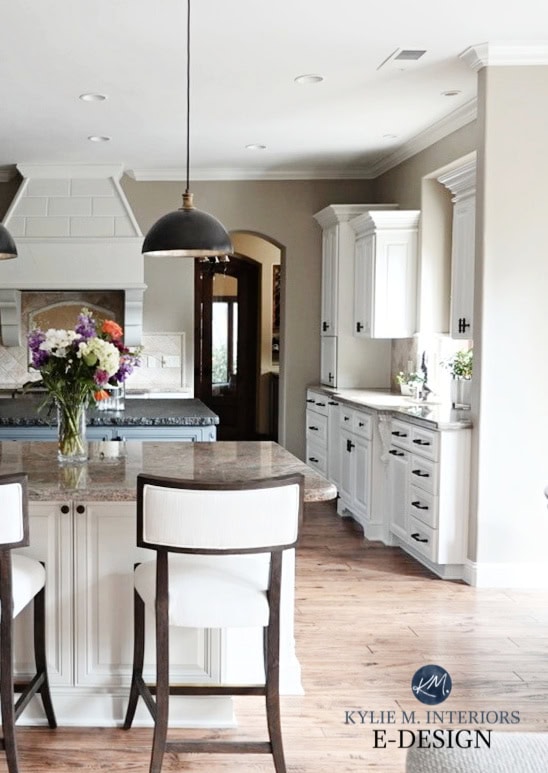 Kitchen with painted off-white cabinets, Sherwin Williams, red oak floor, granite taupe countertops, black. Aesthetic, Kylie M Inter