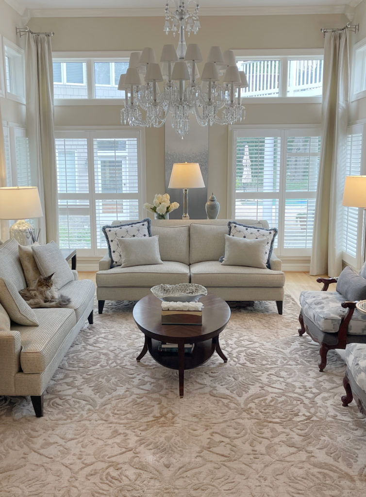 Living room with traditional modern sofa and furnishings, warm paint colour on walls. CLIENT PHOTO before Kylie M Interiors Edesign
