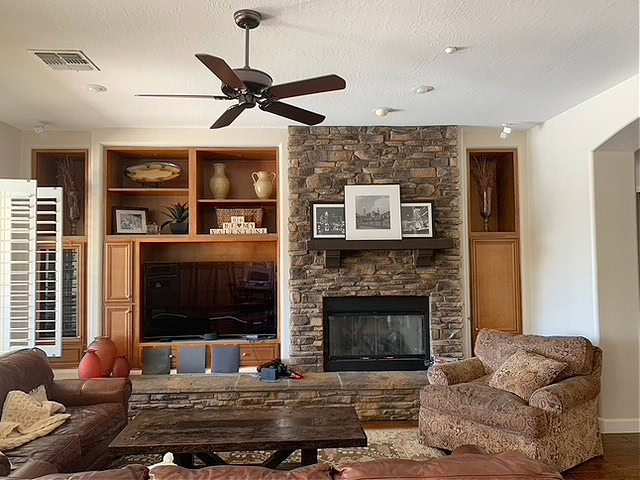 Natural Linen warm neutral paint color, Stone fireplace, maple wood built-ins. Kylie M Interiors Edesign, client photo. Online paint colour consultant