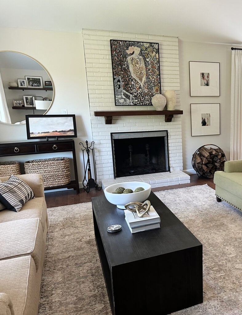 Painted brick fireplae with Sherwin Williams White Duck walls, area rug, room decor and coffee table