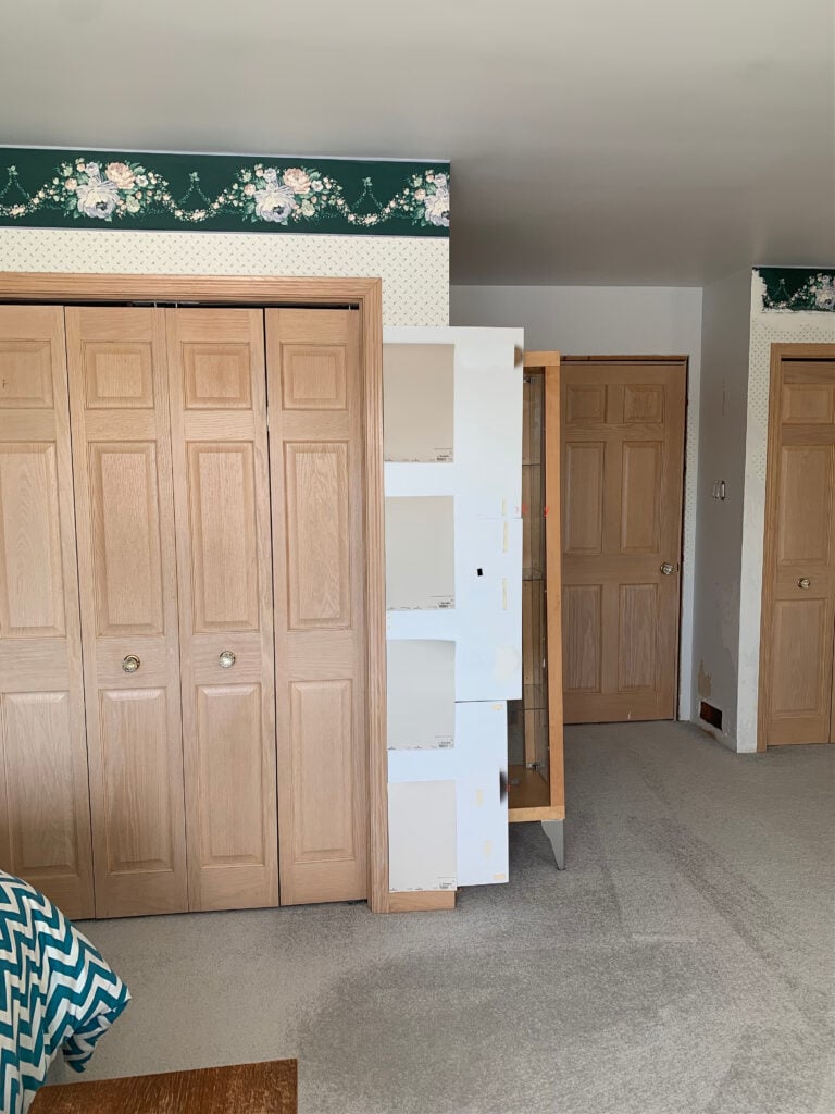 Pink stain, red oak wood stained closet doors, bedroom doors, and wood trim. Taupe, beige pink undertone carpet