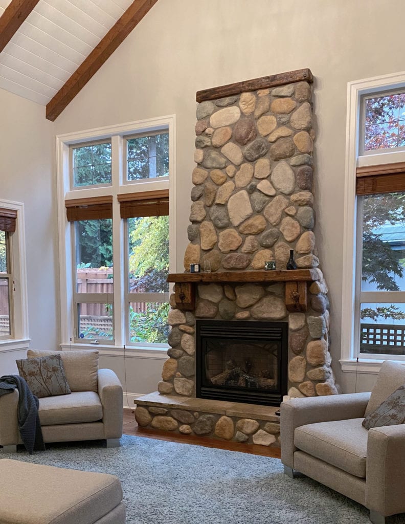 River rock stone fireplace with wood mantel, Benjamin Moore Balboa Mist best paint colour. Kylie M Interiors Edesign, diy update ideas