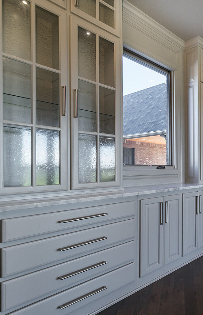 Sherwin William LIght French Gray built-in pantry style cabinets with glass front cabinet doors, quartzite that looks like marble, dark oak floor, Light French Gray and Zurich White (1)