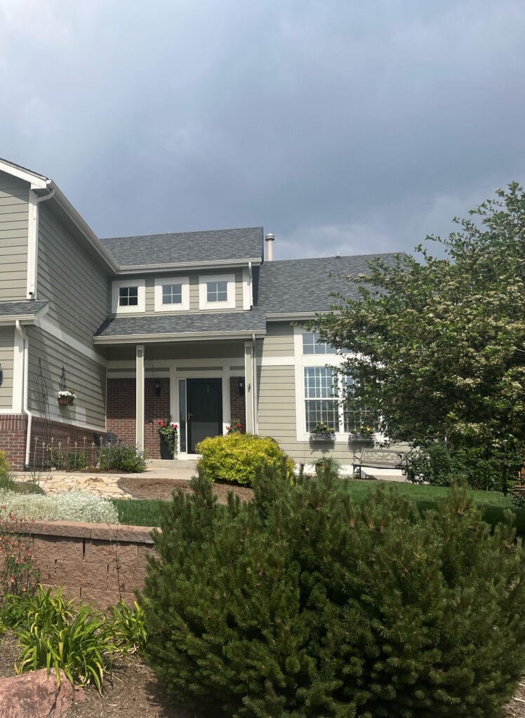 Sherwin Williams Analytical Gray with brick exterior and warm white trim, asphalt roof