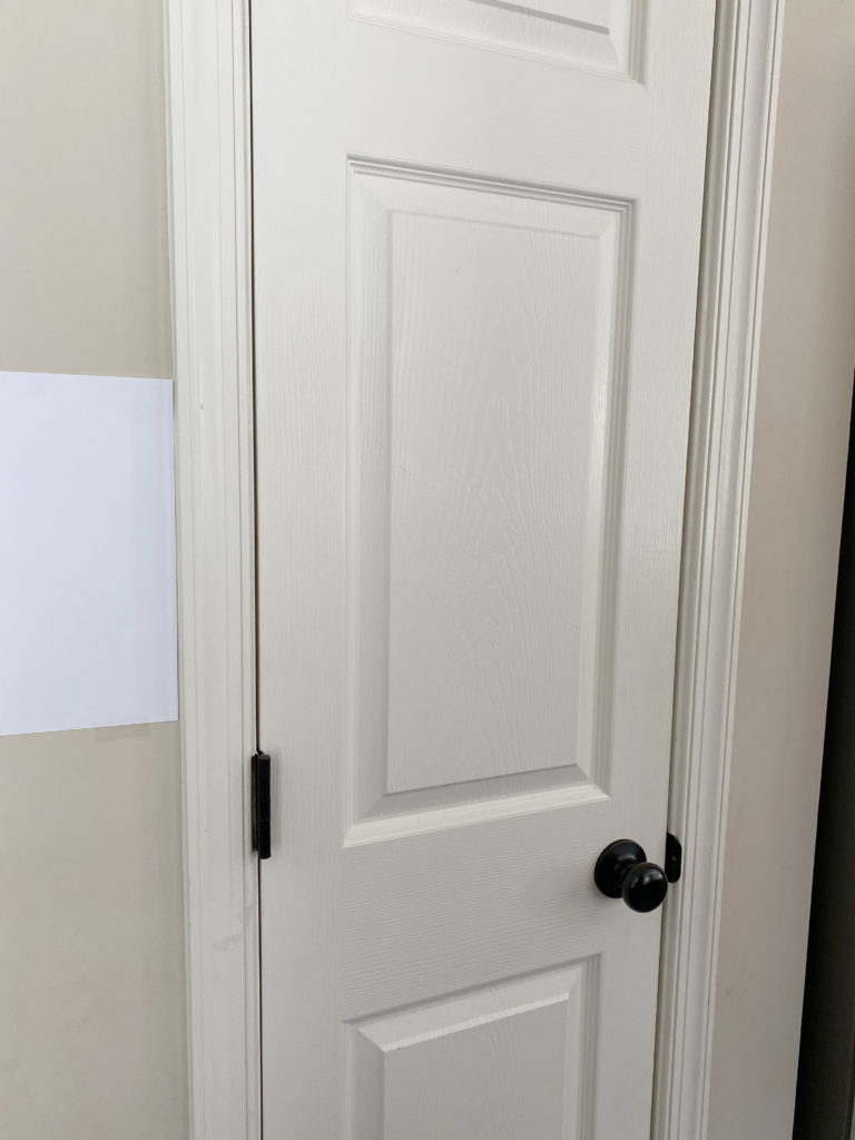 Sherwin Williams Canvas Tan paint colour on walls, Shell White warm soft off-white on door and trim. Kylie M Interiors client BEFORE PHOTO