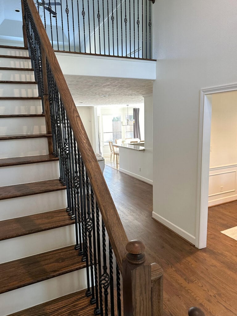 Sherwin Williams Dover White walls, trims, ceiling, staircase and hallway, wood stairs, white risers, wood hand rail, dark oak wood floor