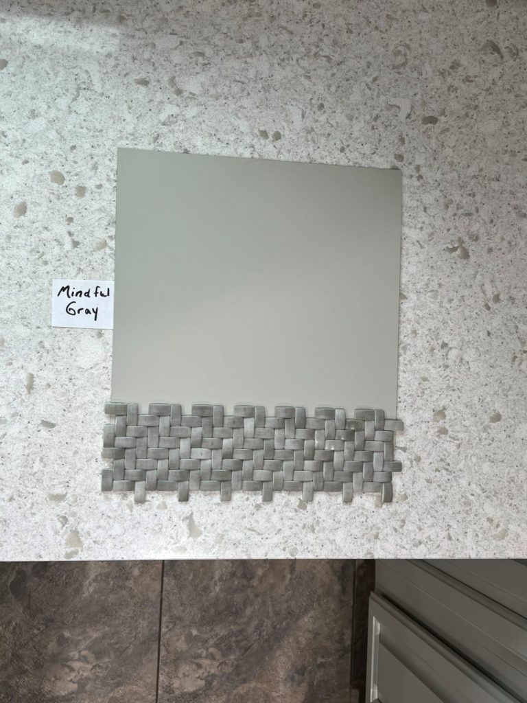 Sherwin Williams Mindful Gray cabinet warm gray greige taupe colour. White greige quartz countertop and backsplash tile. Kylie M