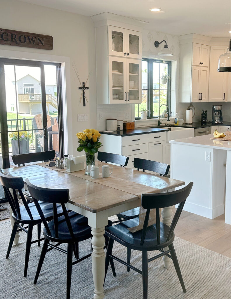 Sherwin Williams White Duck warm off white on walls, Pure White trim, Glacier Wellborn cabinets, Black quartz countertop, white quartz island. (1)
