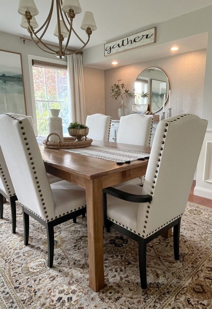 Sherwin Williams Worldly Gray, warm gray greige paint color ion dining room, oak floor, BEnjamin MOore White Dove trim, ceiling, wainscoting, drapes and niche or alcove (2)