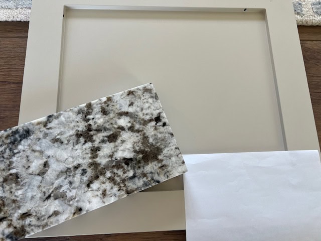 Sherwinm Williams Accessible Beige painted cabinet door sample with granite countertops