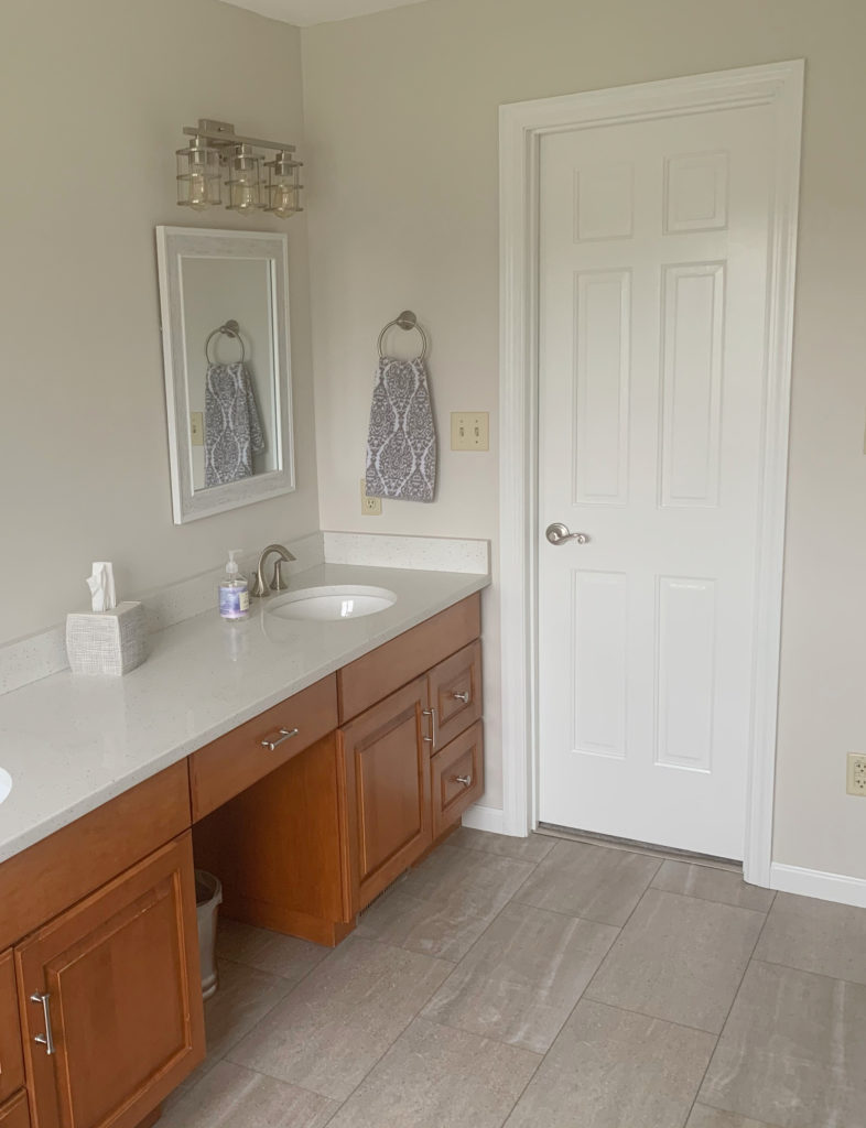 Tile floor with pink undertone, Benjamin Moore Pale Oak walls, orange toned wood vanity BEFORE being painted, Kylie M Interiors Edesign
