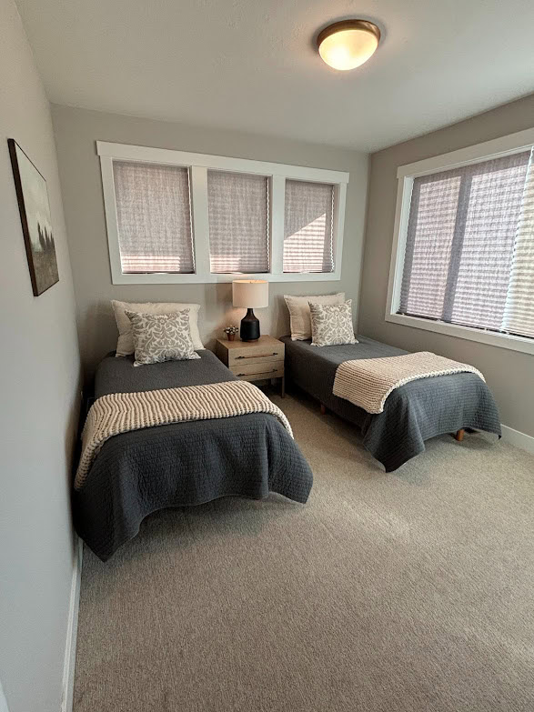 kids or guest bedroom, 2 twin beds, warm gray, taupe carpet, Sherwin Williams Agreeable Gray walls, PUre White trrim