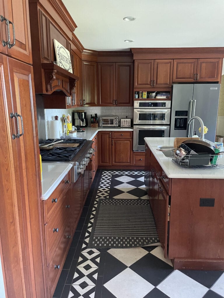 kitchen before black and white cherk floor, cherry red wood cabinets (2)