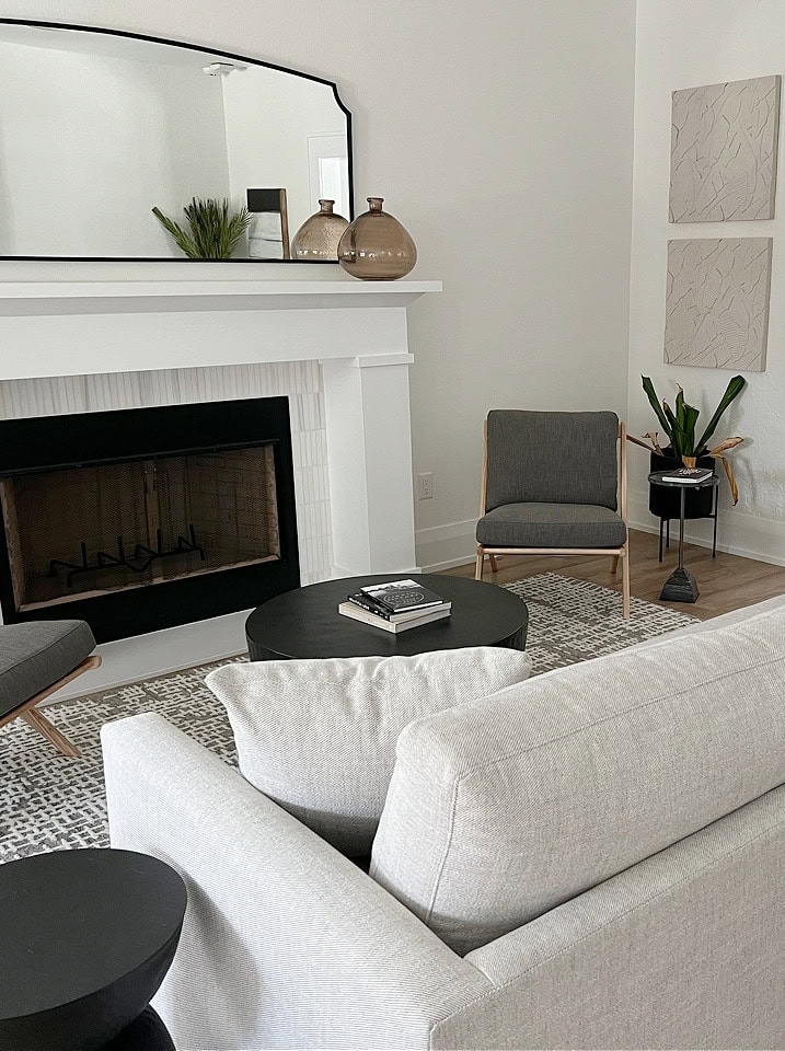 living room with large white fireplace surround, Greek Villa warm white on walls, Extra White trim , shotgun to dining room, neutral home decor and furniturre (3)