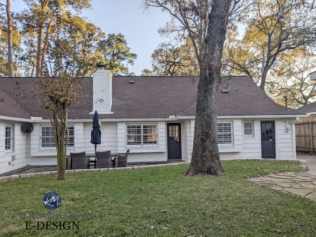 Exterior painted brick with Benjamin Moore Sea Pearl offwhite paint colour. Cheating Heart painted back doors, violet red hue shingle roof. Kylie M Interiors Edes
