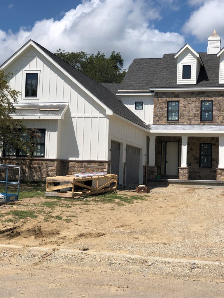 Exterior with brick and Sherwin Williams Greek Villa warm white paint colour. CLIENT PHOTO Kylie M INteriors edesign