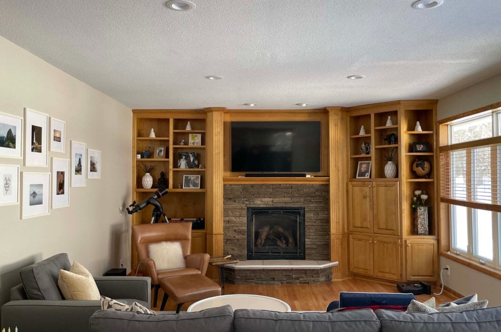 Sherwin Williams Accessible Beige with orange oak cabinet built ins and stone fireplace. Kylie M Interiors Edesign, CLIENT PHOTO