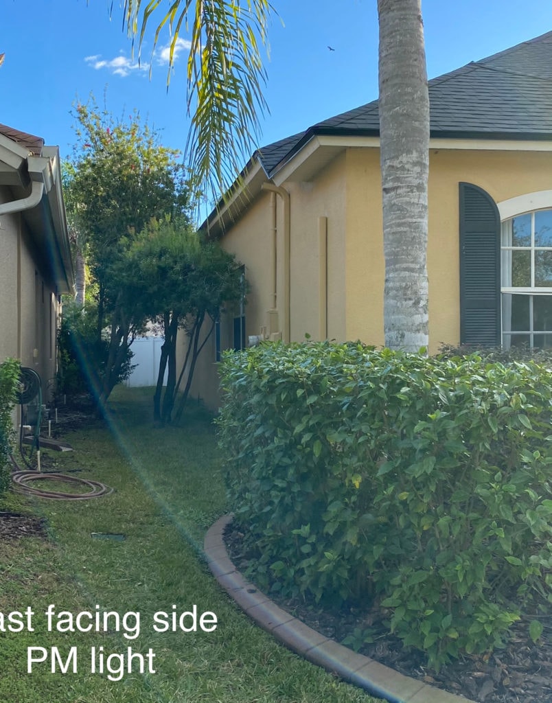 Side of stucco exterior home in yellow BEFORE edesign