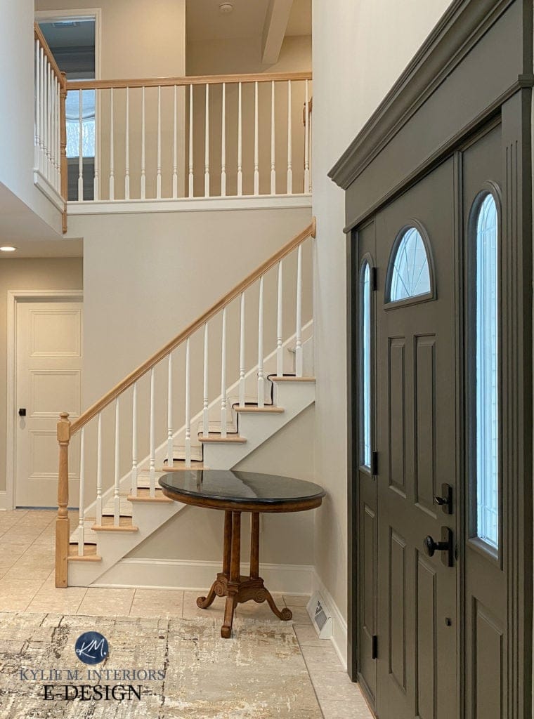 Benjamin Moore Edgecomb Gray paint color on walls, Cloud White trim, Sherwin URbane Bronze front door with beige toned tiles, foyer with oak hand rail, white spindles, Kylie