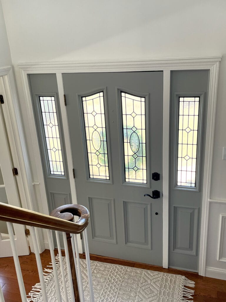 Sherwin Williams Gray Matters painted inside of front door, Benjamin Moore White Dove trim, walls, wainscoting. entryway.