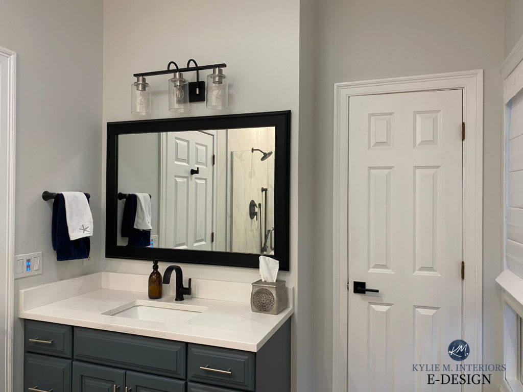 Benjamin Moore Moonshine gray paint colour on walls, Sherwin Williams Grays Harbor painted vanity, white quartz, black hardware, small bathroom. Kylie M Interiors Edesign