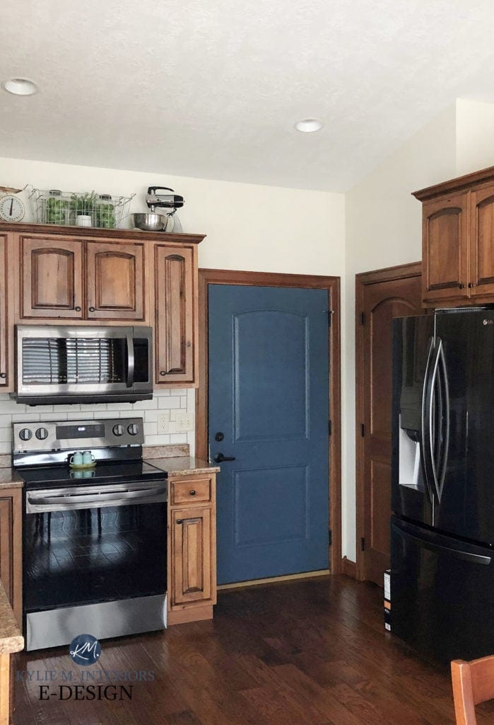 Door painted Sherwin Williams Bunglehouse Blue, walls White Duck, oak wood cabinets, wood trim. Kylie M Interiors Edesign, diy subway tile backsplash, laminate countertop