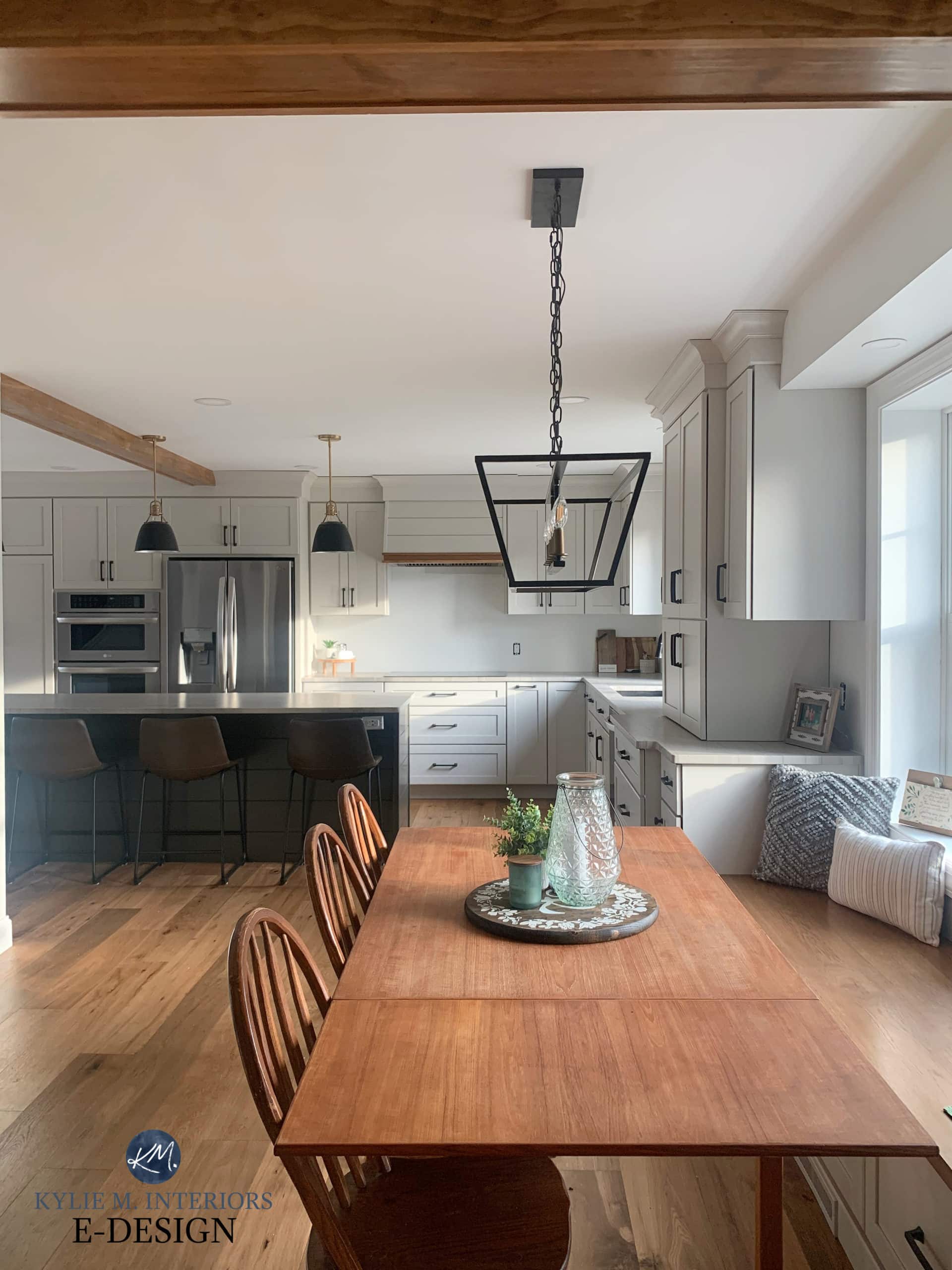 Kitchen with built-in eating bench in nook, cabinets painted Sherwin Williams Agreeable Gray, warm greige taupe paint color, Pure White walls. Kylie M Interiors Edesign