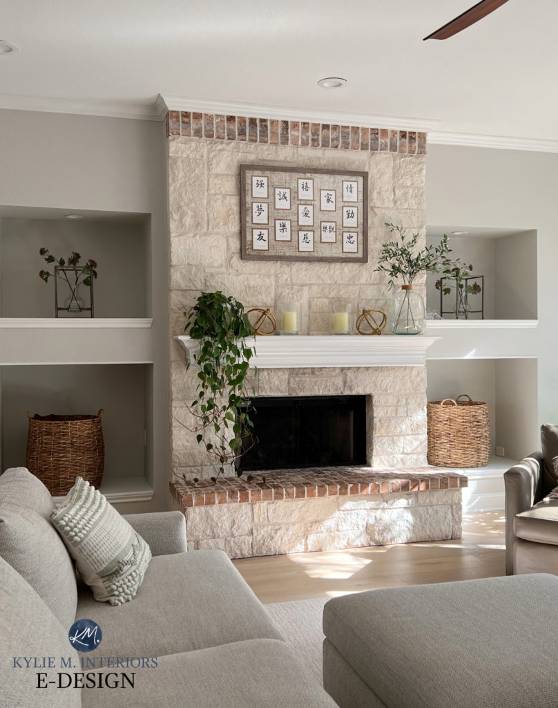 Living or family room, warm cream beige stone fireplace, walls Sherwin Williams Crushed Ice, trim Sherwin Williams Pure White. Fireplace alcoves or niches. Kylie M INteriors Edesign