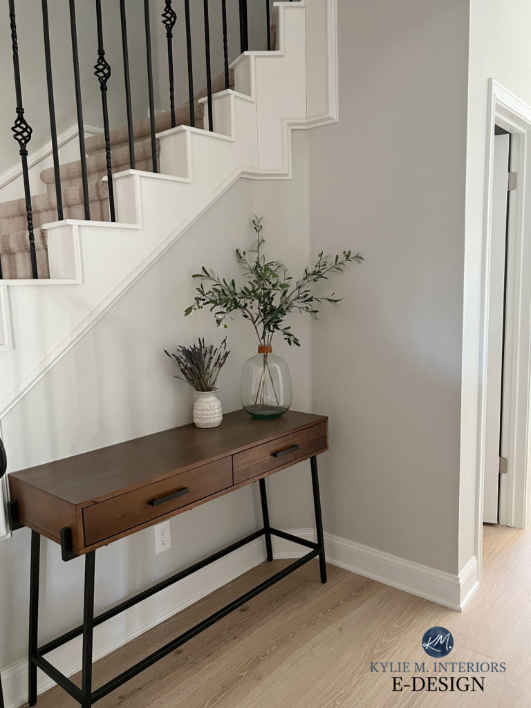 Sherwin Williams Crushed Ice, Pure White trim, black spindles in stairs, light wood flooring. Kylie M Interiors Edesign