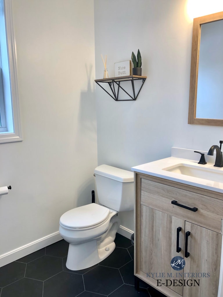 Sherwin Williams PUre White, small bathroom powder room, black hexagon tile floor, wood vanity, white countertop. Kylie M Interiors Edesign