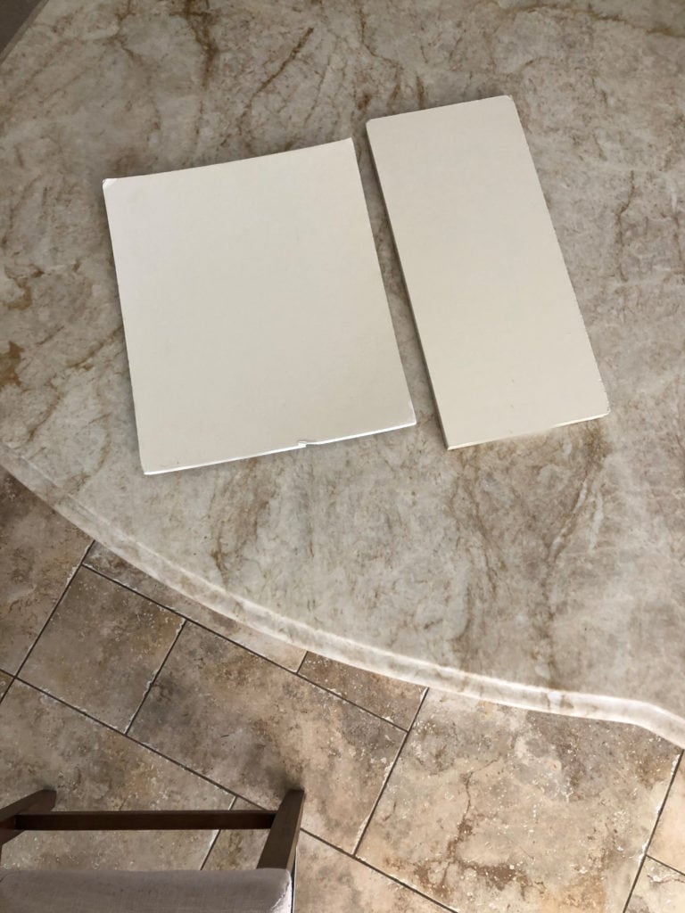 Taj Mahal quartzite with cabinet colours and beige tile flooring