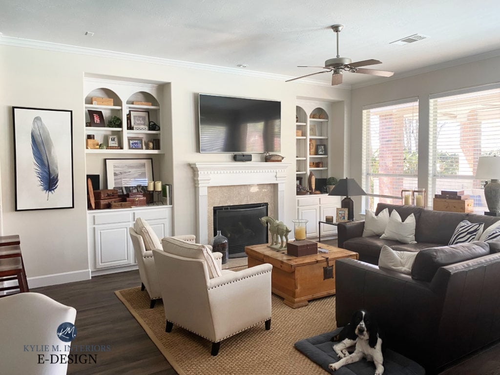 Benjamin Moore Winds Breath, traditional transitional style living room with travertine tile fireplae, beige tan furniture, dark wood floor. Kylie M (2)